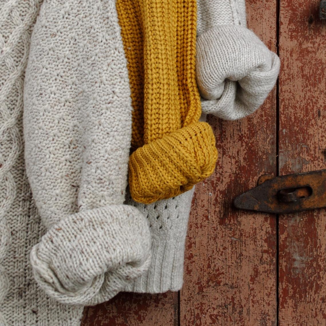 yellow, beige, and grey knitted sweaters